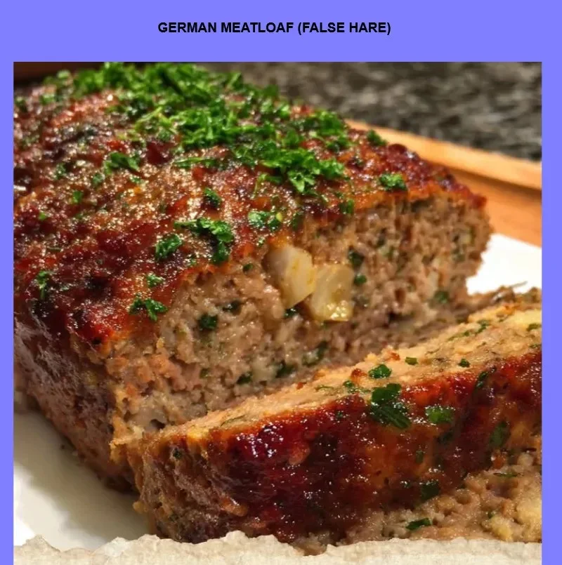 German Meatloaf (False Hare) served with fresh herbs and side dishes