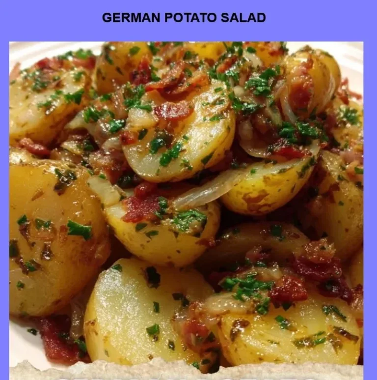 A bowl of traditional German Potato Salad with herbs and spices.