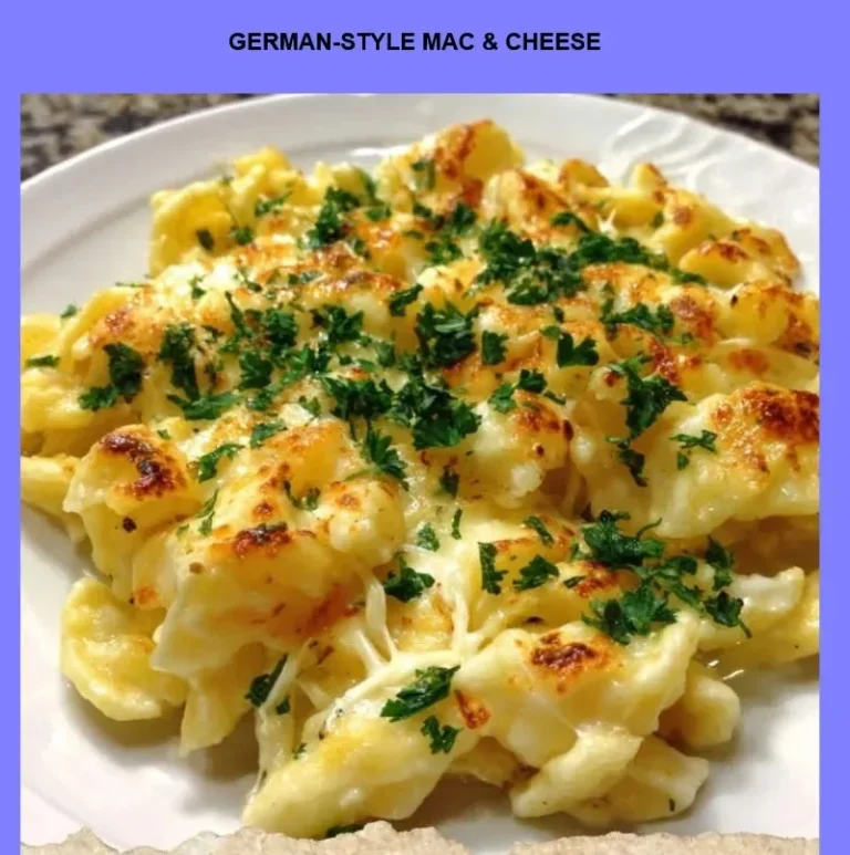 Bowl of German-style mac & cheese topped with herbs and breadcrumbs