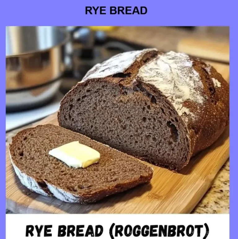 Freshly baked rye bread loaves on a wooden table