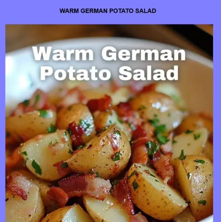 Bowl of warm German potato salad garnished with herbs and bacon