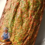 Cake-Like Banana Bread Delicious slice of cake-like banana bread topped with walnuts