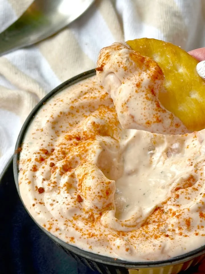 Delicious crawfish salad sandwich with fresh ingredients and a side of greens