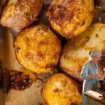 Golden and crispy coated potatoes served on a plate.