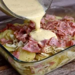 Delicious dish of potatoes with ham, garnished and ready to serve.