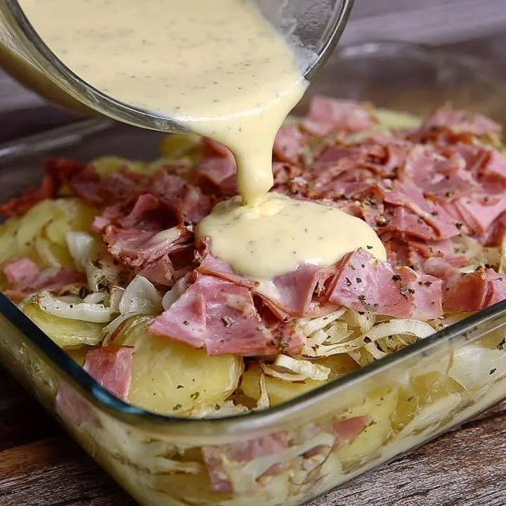 Delicious dish of potatoes with ham, garnished and ready to serve.