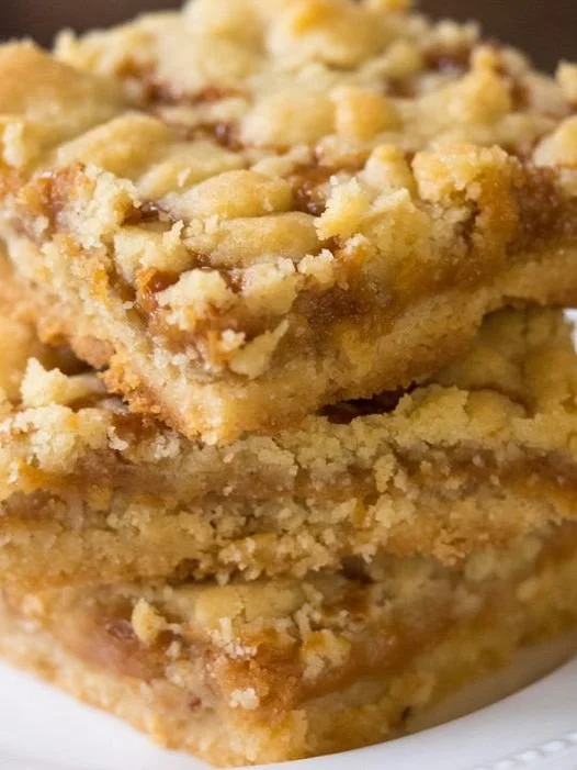 Assorted sweet treats including cakes, cookies, and pastries on a dessert table.