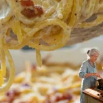 A delicious serving of baked noodles topped with cheese and herbs.