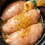 Easy slow cooker chicken recipe with Italian dressing ingredients and finished dish