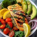 Grilled Salmon Power Bowl A vibrant grilled salmon power bowl topped with fresh veggies and grains