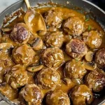 Delicious meatballs coated in a rich mushroom sauce served in a bowl.