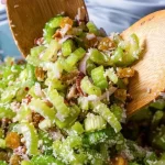 A bowl of the most delicious salad with colorful vegetables and dressing.