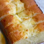 Freshly baked banana bread loaf on a wooden table