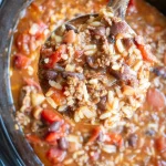 A bowl of hearty Crockpot Soup filled with vegetables and spices.