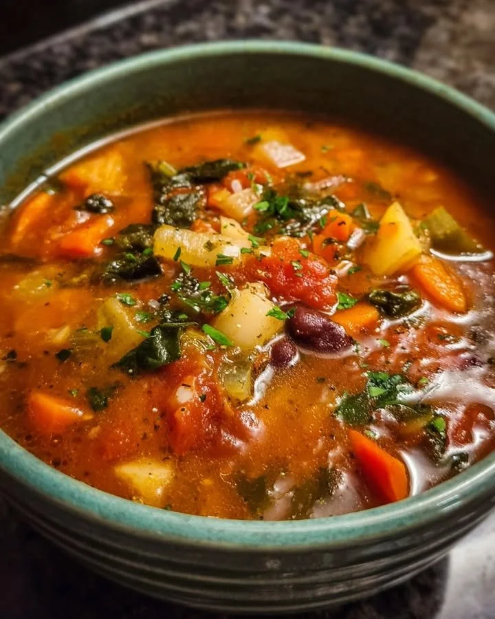 Bowl of easy weeknight soup garnished with herbs and spices