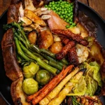Giant homemade Yorkshire roast dinner with traditional sides and gravy