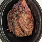 Delicious Honey Baked Ham served on a platter with sides