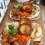 My daughter's first chicken dinner featuring juicy roasted chicken and vegetables.