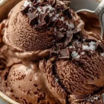No-churn chocolate ice cream in a bowl with chocolate shavings
