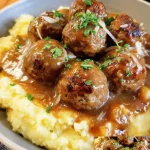 Salisbury steak meatballs served with rich onion gravy on a plate