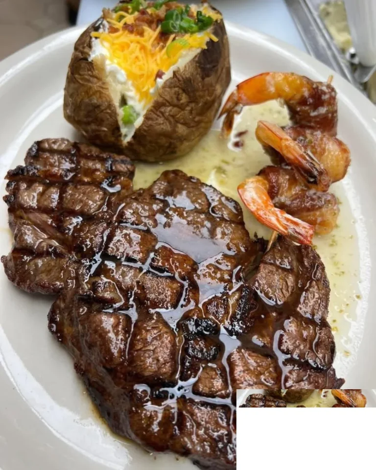 Grilled steak and shrimp served together on a plate