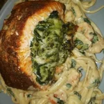 Blackened salmon fillet stuffed with spinach and Parmesan cheese