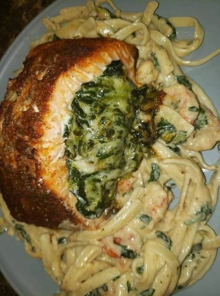 Blackened salmon fillet stuffed with spinach and Parmesan cheese