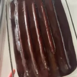 Delicious bumpy cake with colorful icing and decorative topping.