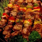 Chicken, bacon, and pineapple kebabs ready for grilling