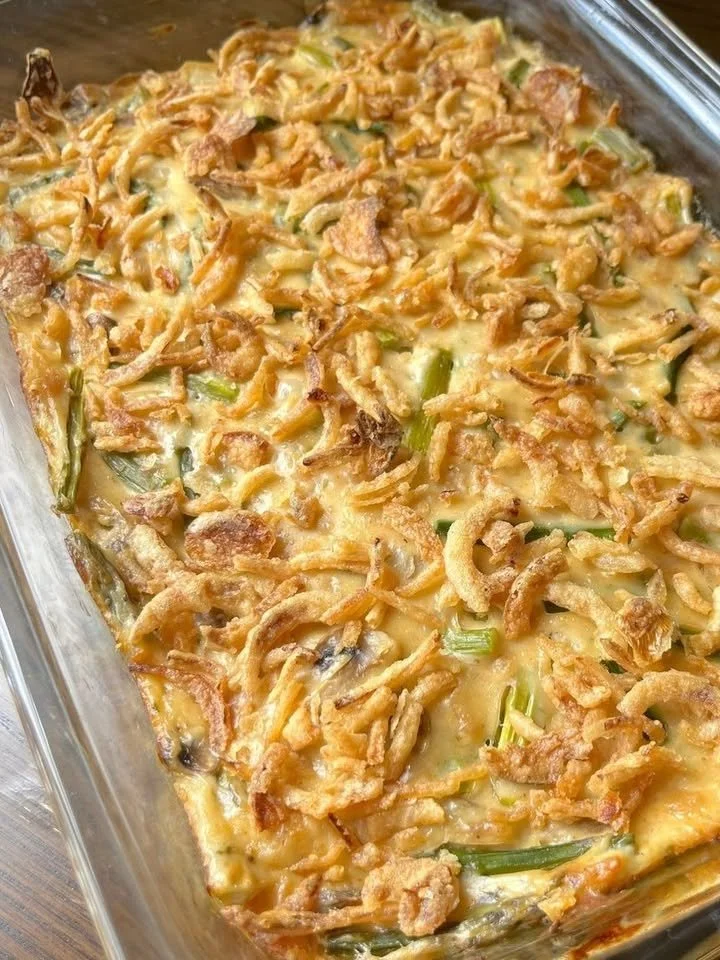 Colorful fresh spring salad with greens, vegetables, and vinaigrette dressing.