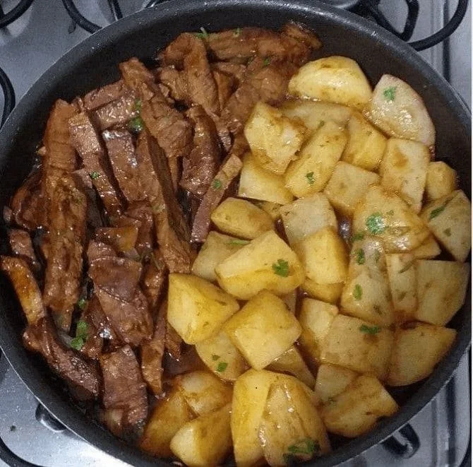 Garlic Butter Steak and Potatoes Skillet served in a cast iron pan