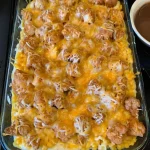 Delicious mashed potato casserole topped with crispy chicken ready to serve.