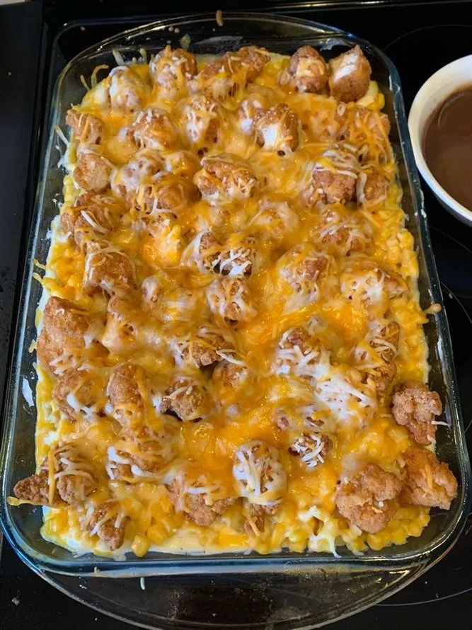 Delicious mashed potato casserole topped with crispy chicken ready to serve.