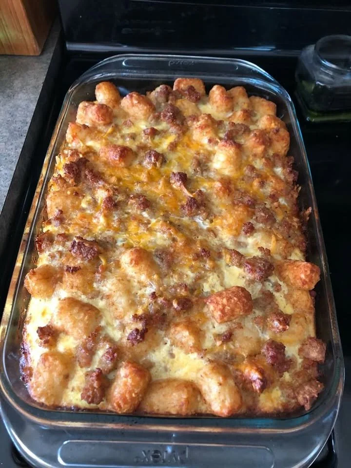 Tater Tot Sausage Breakfast Casserole ready to serve on a rustic dining table